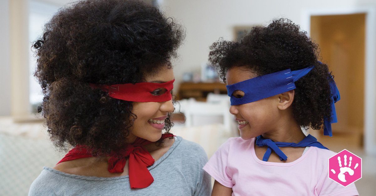 mother and daughter with superhero masks